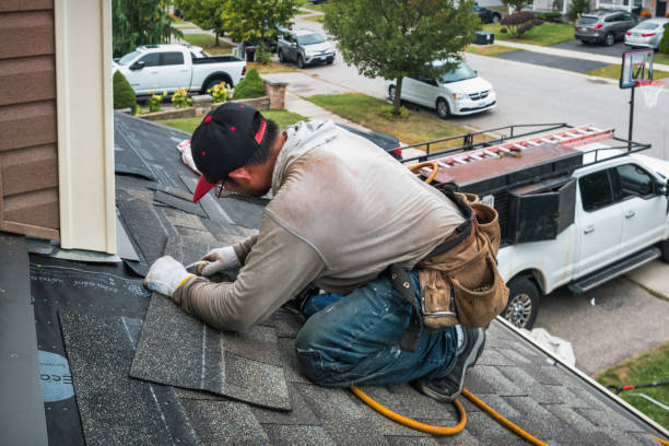 Professional Roofing technician working in Arlington, OR